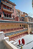 Ladakh - Tikse gompa, the main monastery halls with the characteristc red painted windows and woden balconies